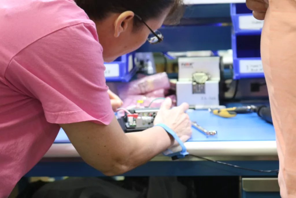 Woman working on product assembly