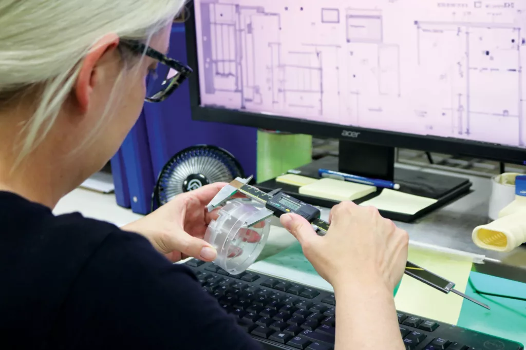 Woman using calipers